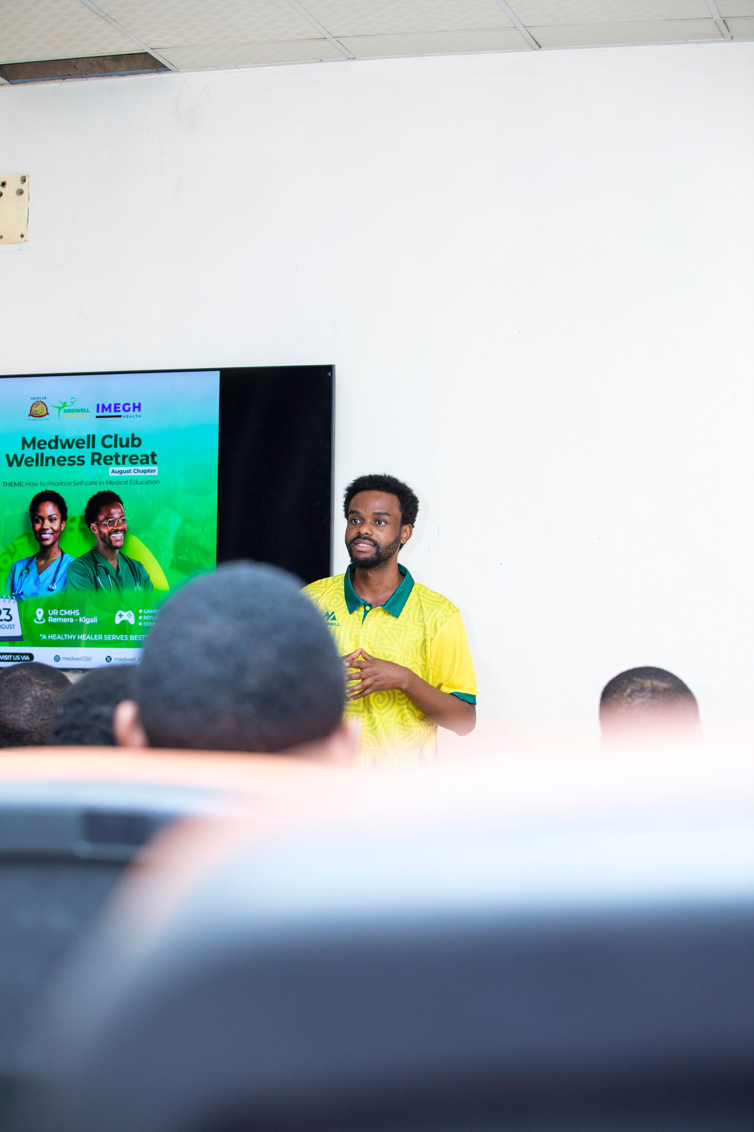 Bonheur Mwizerwa delivering opening remarks at the Wellness Retreat.