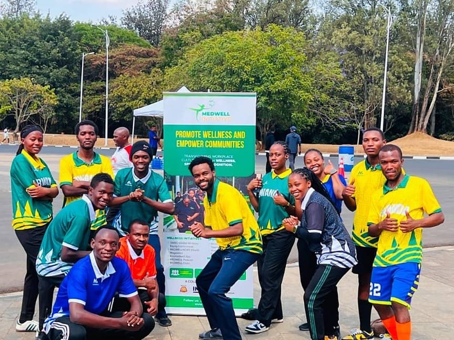 MedWell Club members gathered around the MedWell banner at Kigali Car Free Day, September 2026.