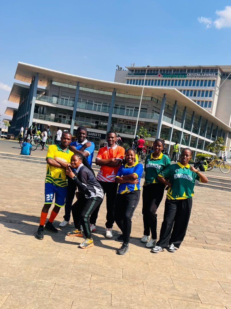 MedWell Club members in jerseys posing together in front of a large building during Car Free Day.